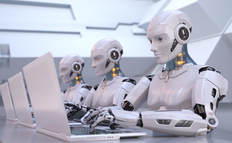 Multiple robots are typing at their laptops in concentration.