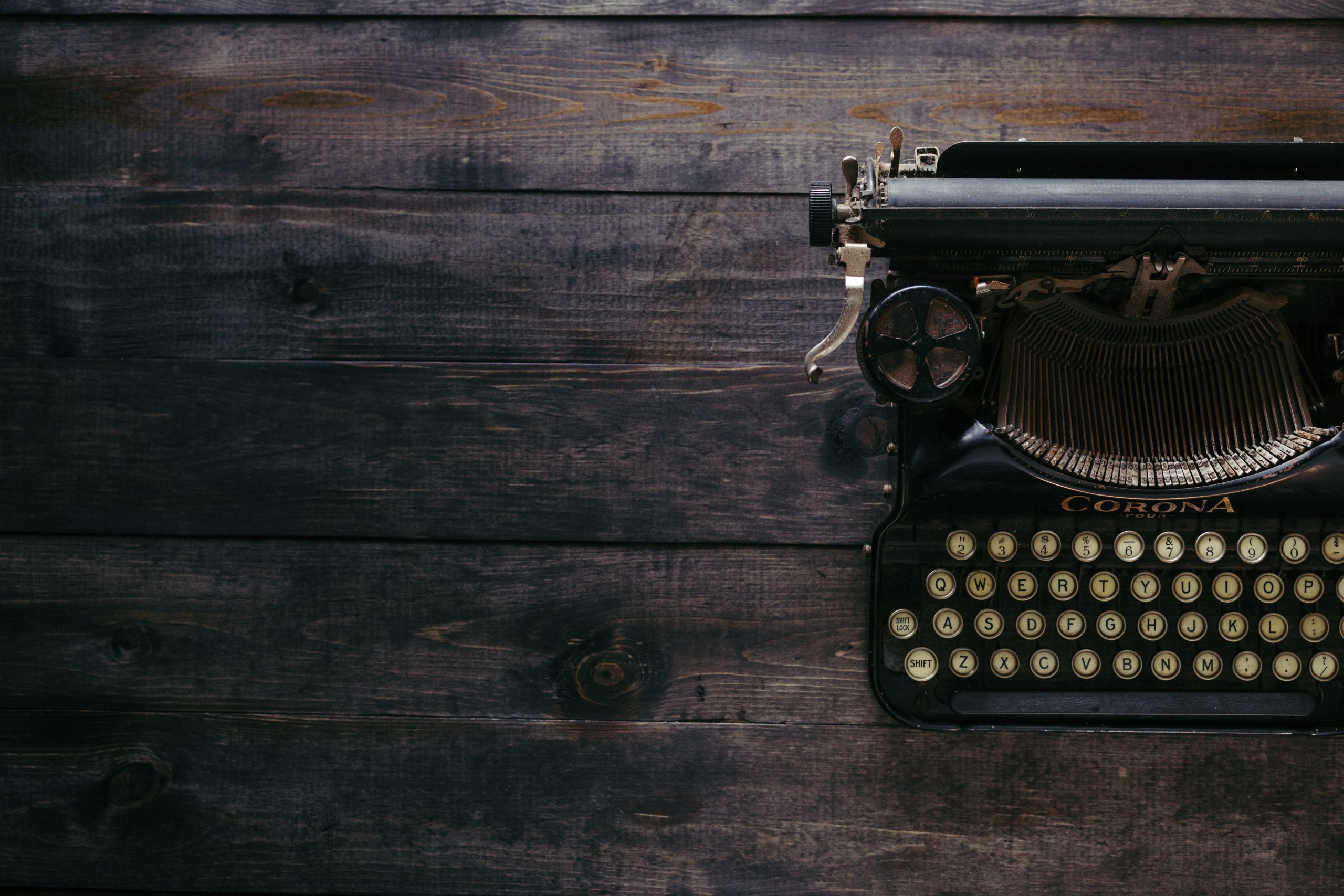 Typewriter on Wooden Desk